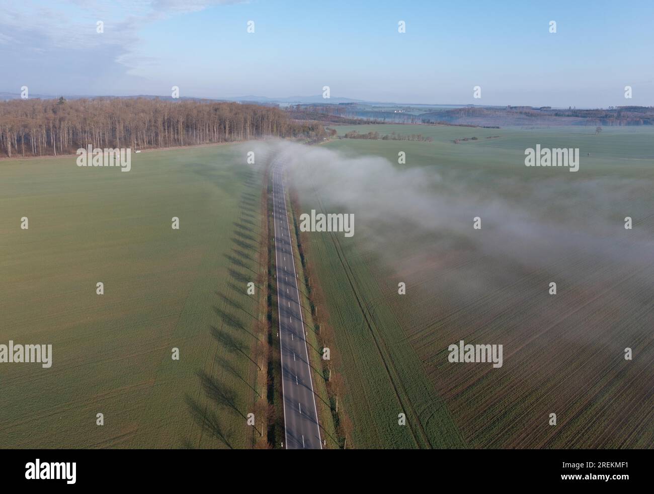 Country road with fog cloud from the air Stock Photo - Alamy