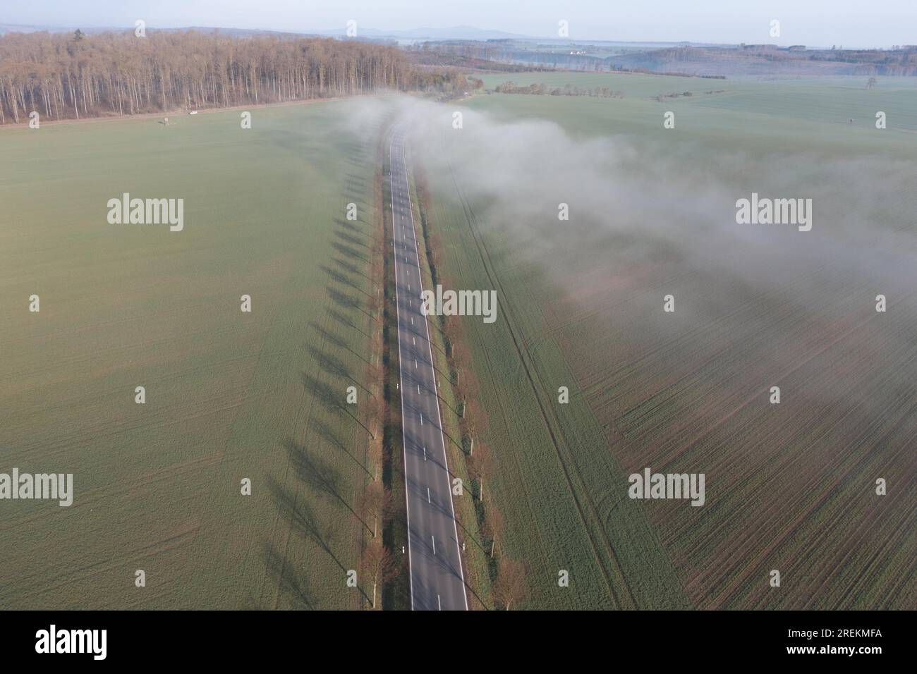 Country road with fog cloud from the air Stock Photo - Alamy