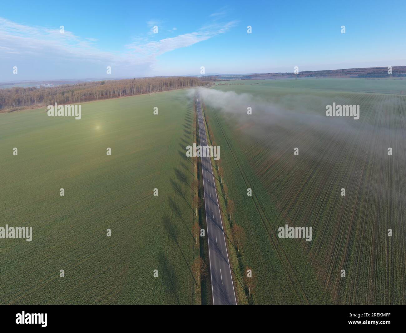 Country road with fog cloud from the air Stock Photo - Alamy
