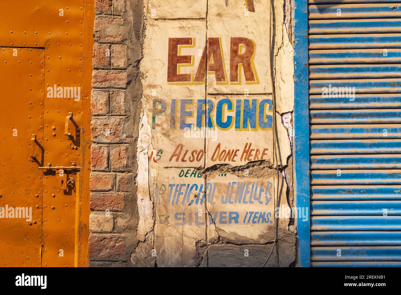 Bohri Kadal, Srinagar, Jammu and Kashmir, India. October 25, 2022. Sign advertising ear piercing in Srinagar. Stock Photo