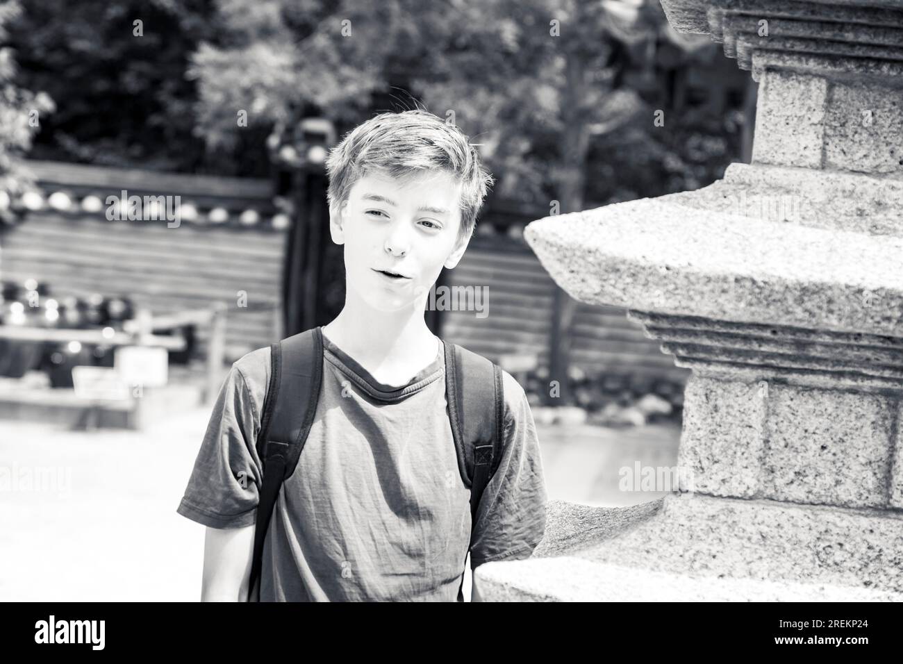 Black and white portrait of a smiling teenage boy Stock Photo