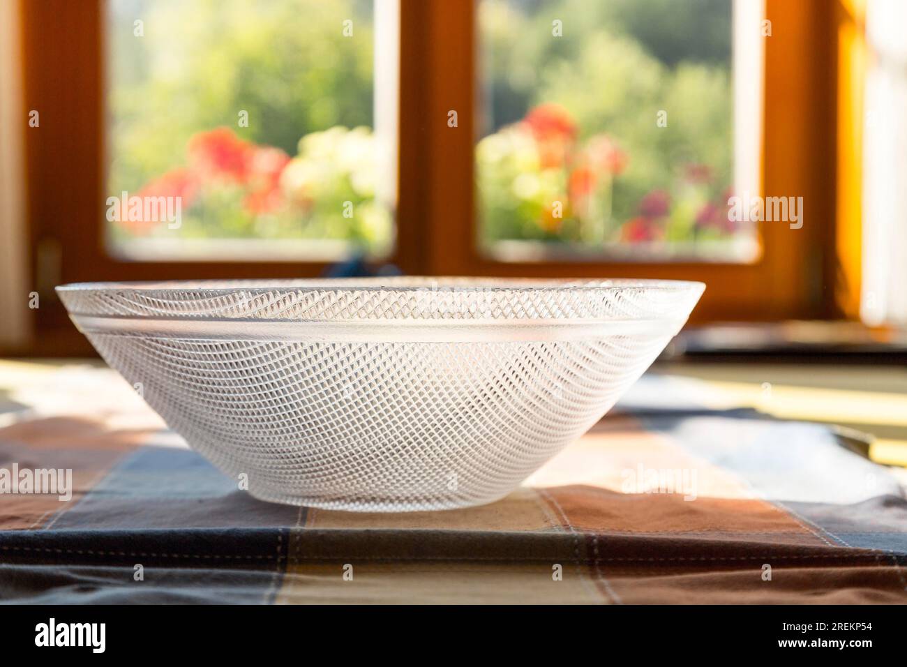 Close up of a simple glass bowl on a table Stock Photo