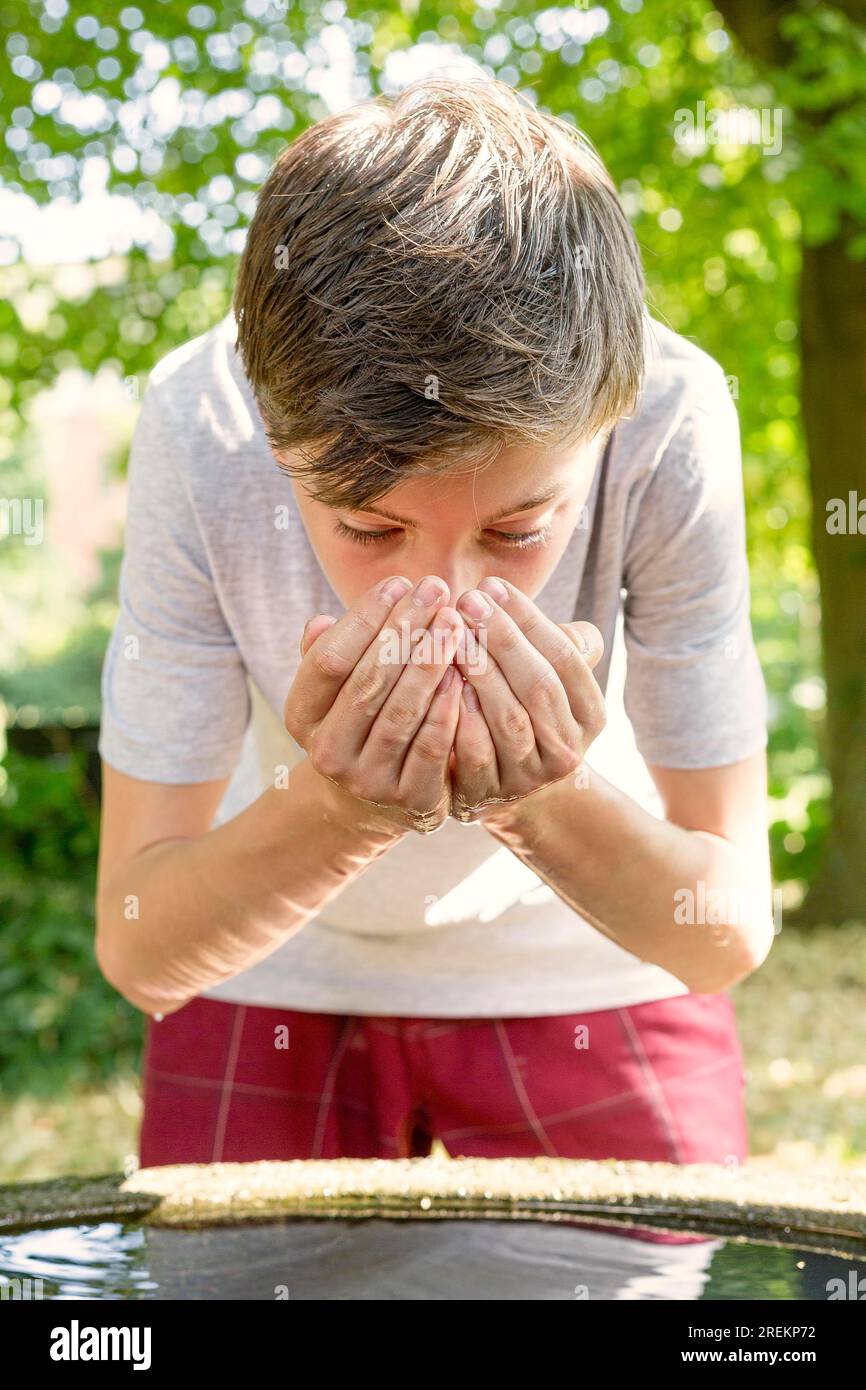 Teenage boy drinking water hi-res stock photography and images - Alamy