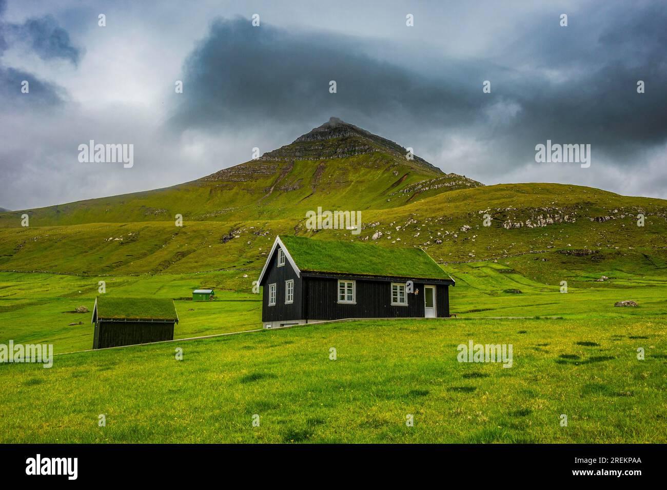 Lonely grass roofed house in Gjogv, Estuyroy, Faroe islands, Denmark Stock Photo