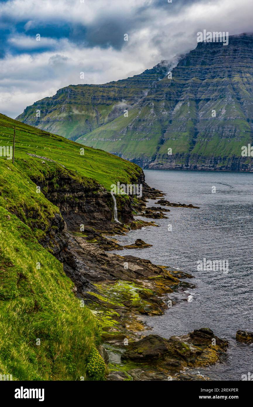 Waterfall into the ocean, Bordoy, Faroe islands, Denmark Stock Photo