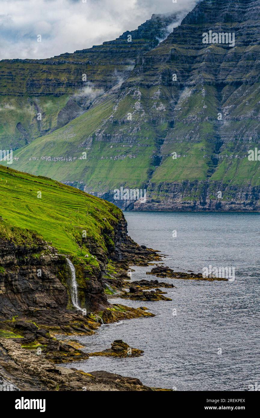 Waterfall into the ocean, Bordoy, Faroe islands, Denmark Stock Photo