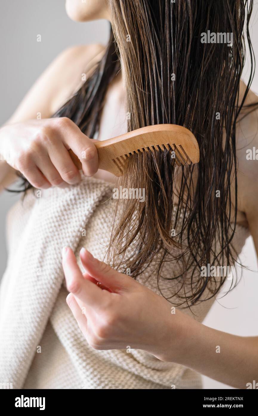 Close up woman combing hair. Resolution and high quality beautiful photo Stock Photo