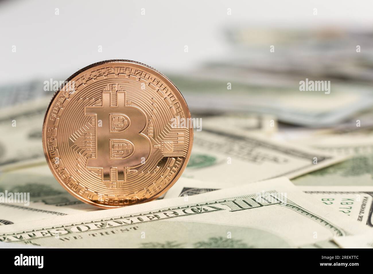 Copper bitcoin top dollar bills. Resolution and high quality beautiful  photo Stock Photo - Alamy