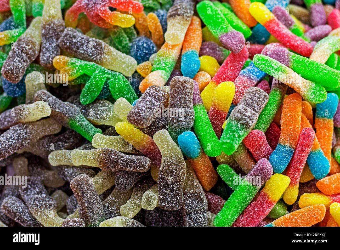 abstract background of multi-colored stripes of jelly with sourness in sugar Stock Photo