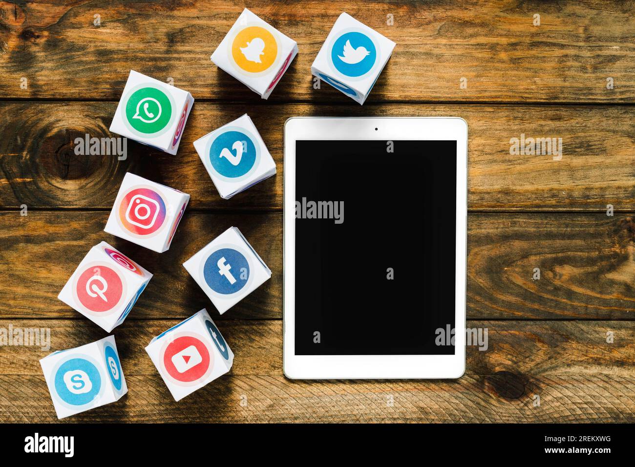 High angle view digital tablet near boxes with media icons. High resolution photo Stock Photo