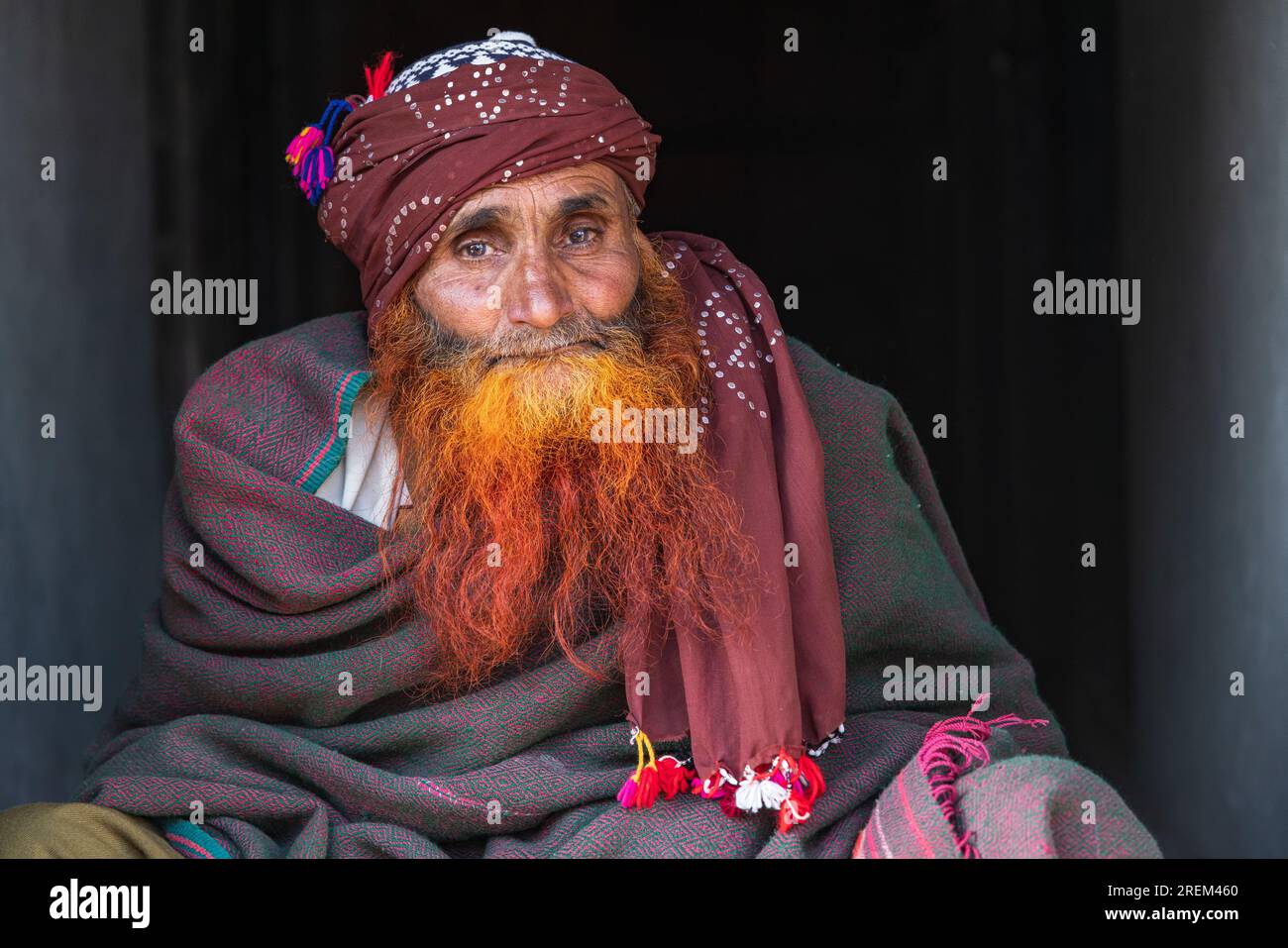 Khansahib Tehsil, Jammu and Kashmir, India. October 31, 2022. Man with a red henna dyed beard in a village in Jammu and Kashmir. Stock Photo