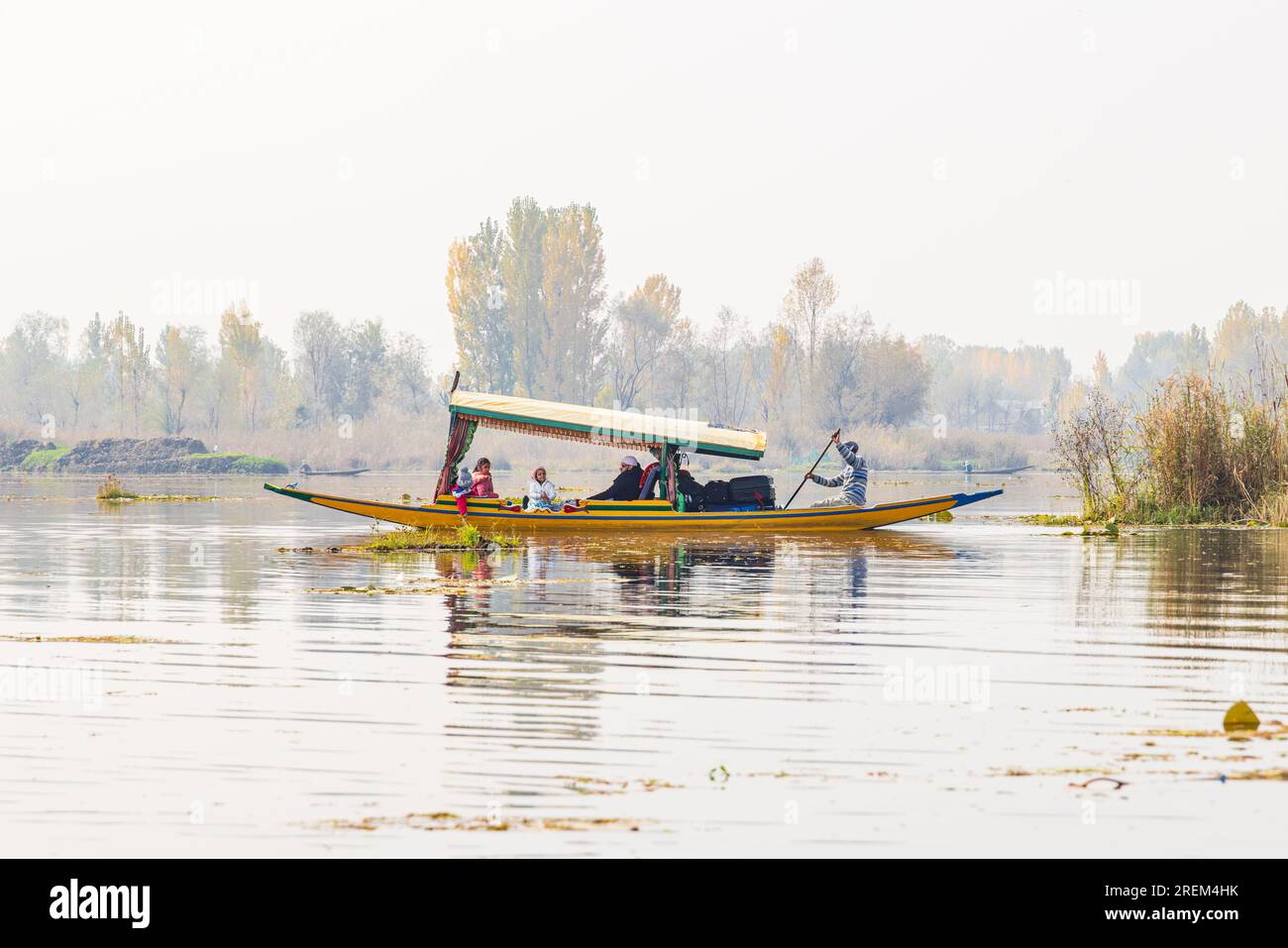 Dal Lake, Srinagar, Jammu and Kashmir, India. November 1, 2022. Tourists in a traditional boat at Dal Lake. Stock Photo