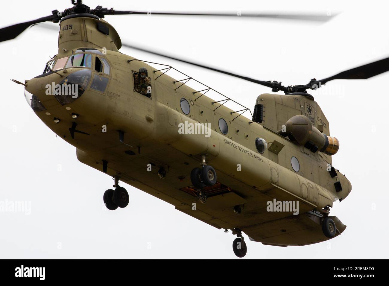 A Boeing CH-47 Chinook assigned to the 5-159th General Service Aviation Battalion from Fort Eustis, Virginia, carrying Soldiers from the 78th Training Division, approaches a landing zone (LZ) for warrior exercise (WAREX) 2023, Joint Base Mcguire-Dix-Lakehurst, July 24, 2023. The 78th soldiers prepared to secure the LZ after landing as part of their combat readiness training. (This image is cropped, color and exposure edited to enhance the subject) (U.S. Army Reserve Photo by Spc. Jeremy Price) Stock Photo