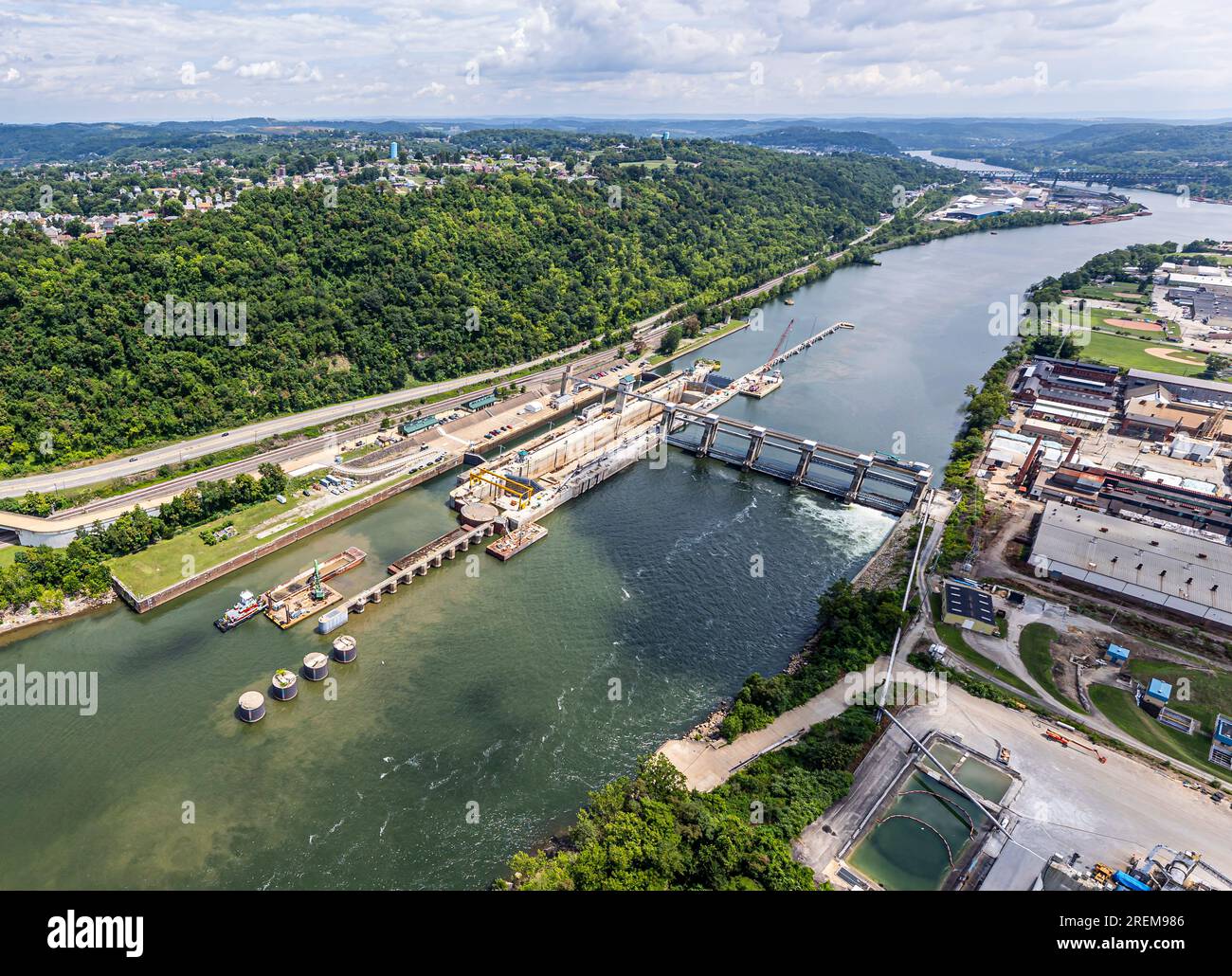 The photo above is an aerial view of Monongahela River Locks and Dam 4 near Charleroi, Pennsylvania, July 21, 2023. The facility is one of nine navigation structures on the Monongahela River that provide navigation from Fairmont, West Virginia, to downtown Pittsburgh. The U.S. Army Corps of Engineers started constructing the lock at Charleroi in 1931 and finished in 1932. The project became operational Aug. 14, 1932. The most recent construction at the facility began in 1994 to replace the main chamber with a new lock measuring 720 feet long and 84 feet wide. Charleroi is located at river mile Stock Photo
