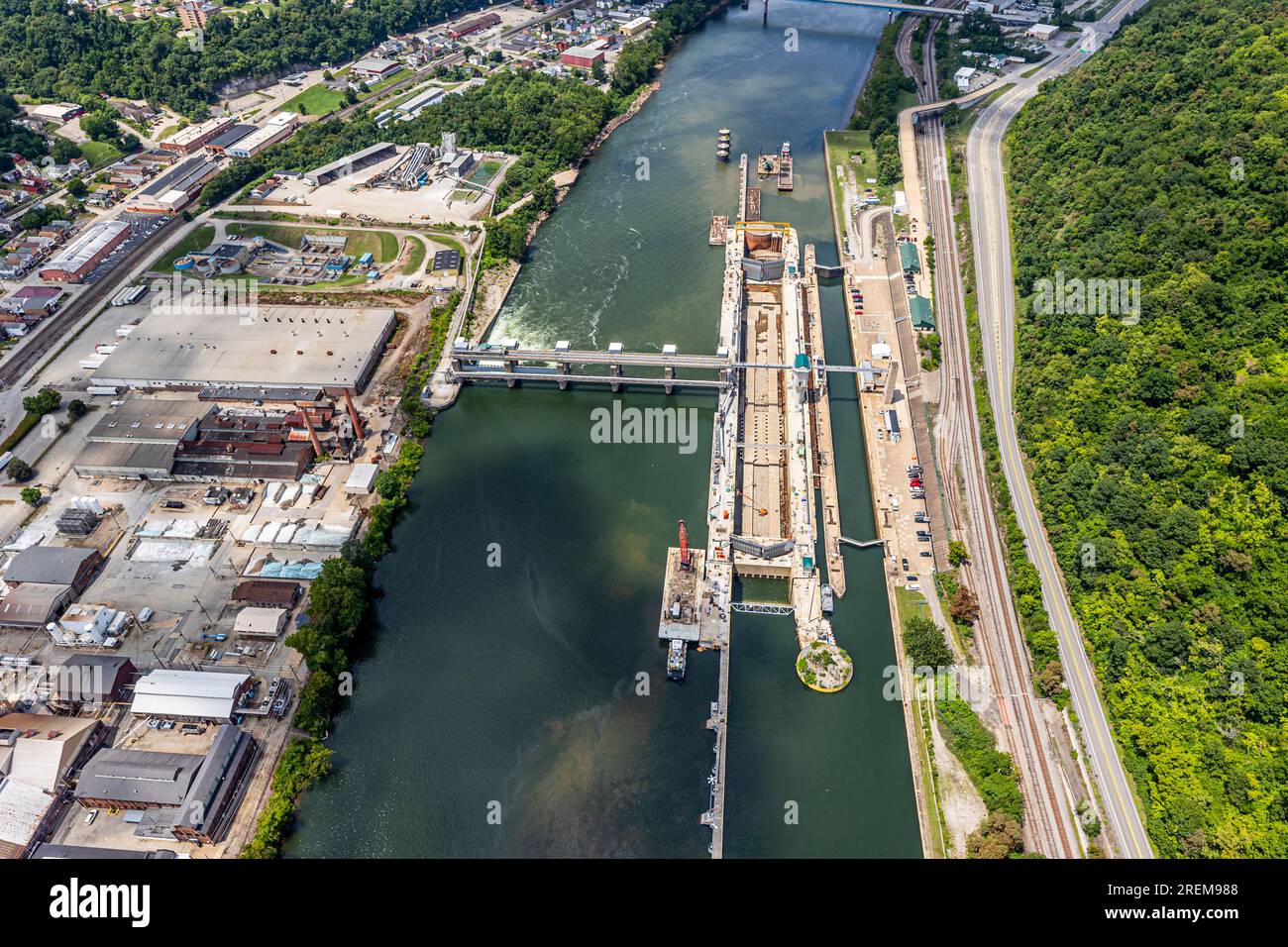 The photo above is an aerial view of Monongahela River Locks and Dam 4 near Charleroi, Pennsylvania, July 21, 2023. The facility is one of nine navigation structures on the Monongahela River that provide navigation from Fairmont, West Virginia, to downtown Pittsburgh. The U.S. Army Corps of Engineers started constructing the lock at Charleroi in 1931 and finished in 1932. The project became operational Aug. 14, 1932. The most recent construction at the facility began in 1994 to replace the main chamber with a new lock measuring 720 feet long and 84 feet wide. Charleroi is located at river mile Stock Photo