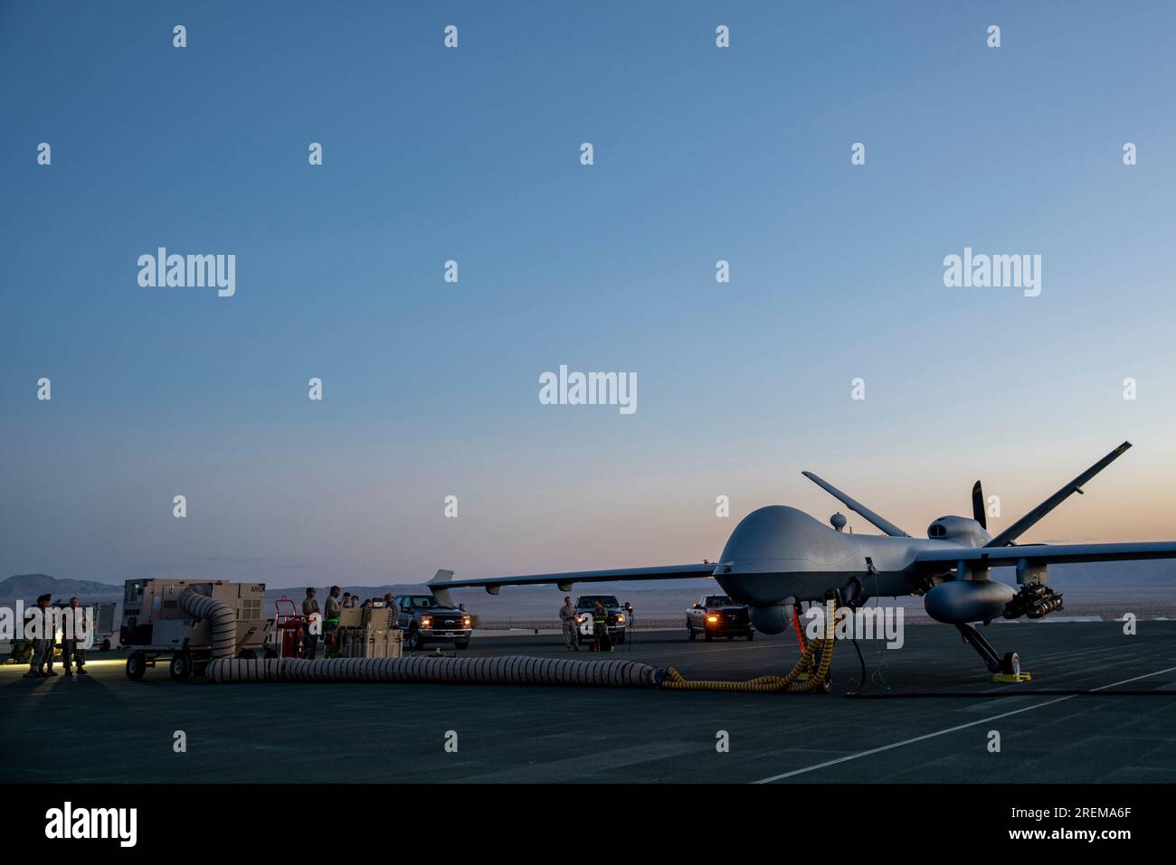U.S. Air Force Airmen from the 432nd Maintenance Squadron stand by to