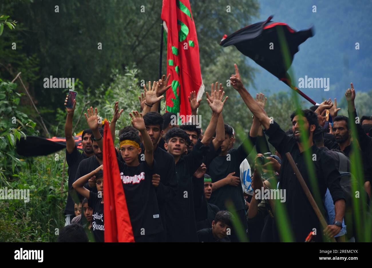 Kashmiri Shiite Muslims chant religious slogans as they participate in ...