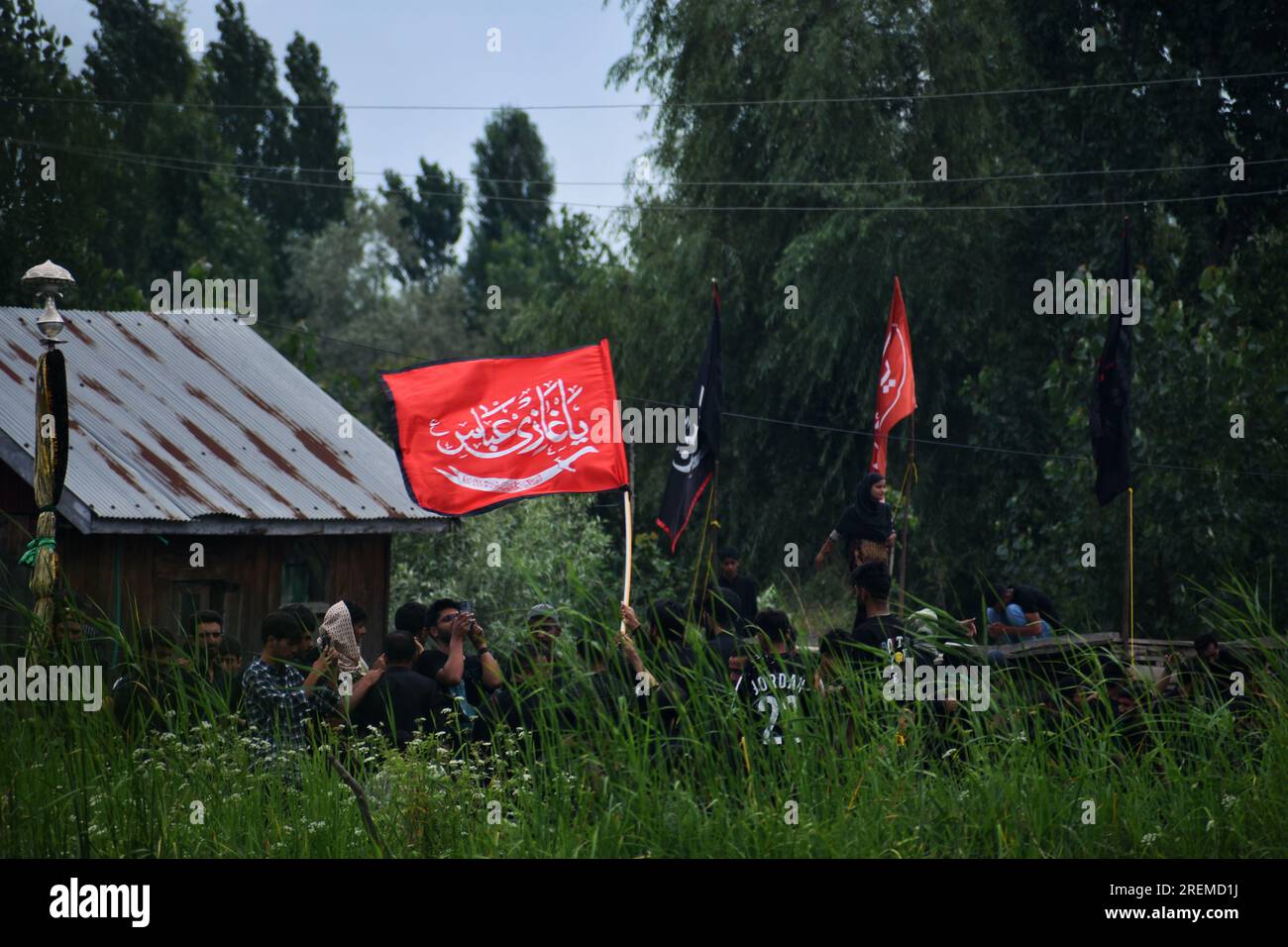 Kashmiri Shiite Muslims chant religious slogans as they participate in ...