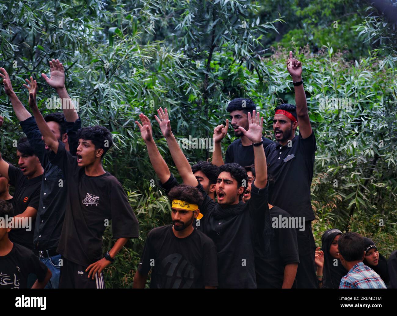Kashmiri Shiite Muslims chant religious slogans as they participate in ...