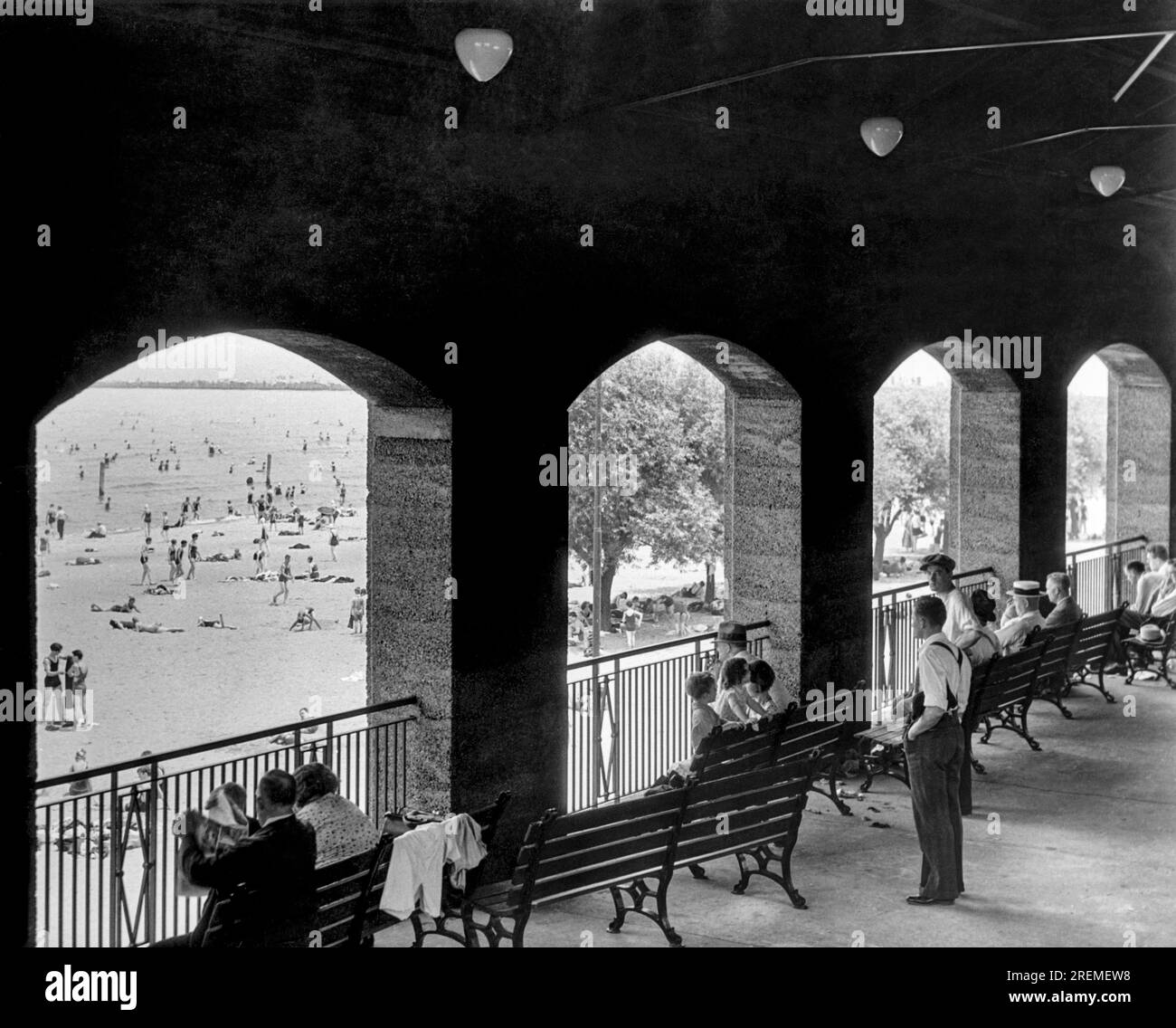 Chicago, Illinois:  c. 1929 Spectators watching the beach-goers at Jackson Park Beach. Stock Photo