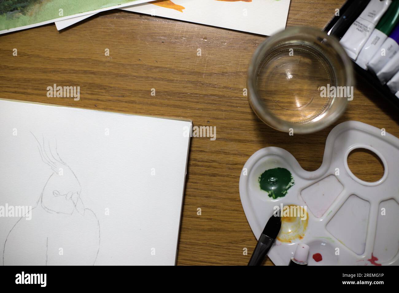 watercolor, painting, wooden background, brushes and water Stock Photo