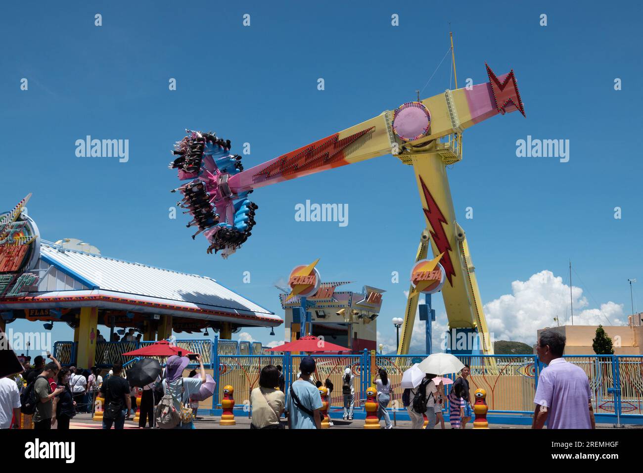 Hong Kong, CHINA - JULY 24, 2023 - Visitors ride a