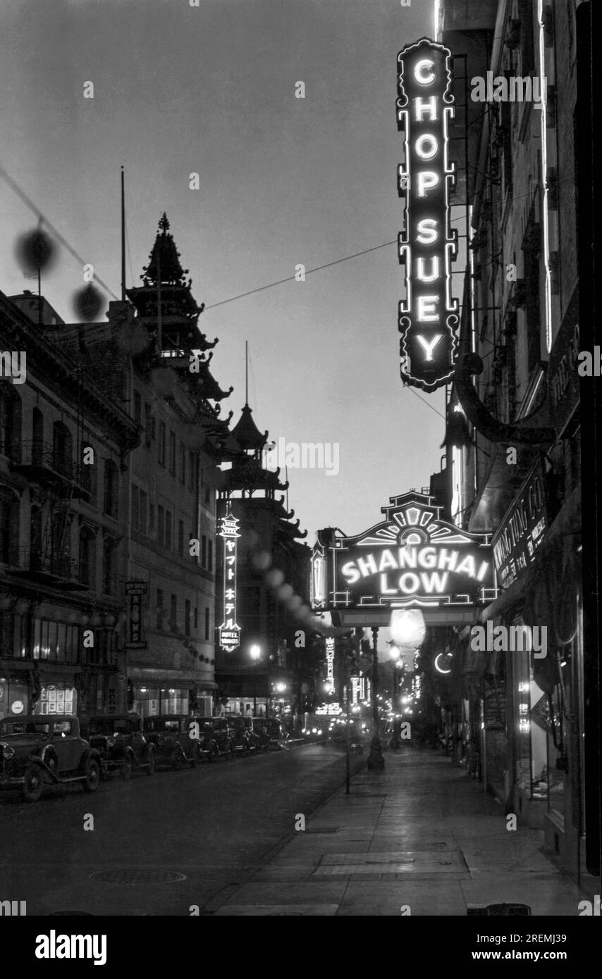 San Francisco, California:    1935 A nighttime view down Grant Avenue with the Shanghai Low, Chinatown's most popular nightclub on the right. Stock Photo