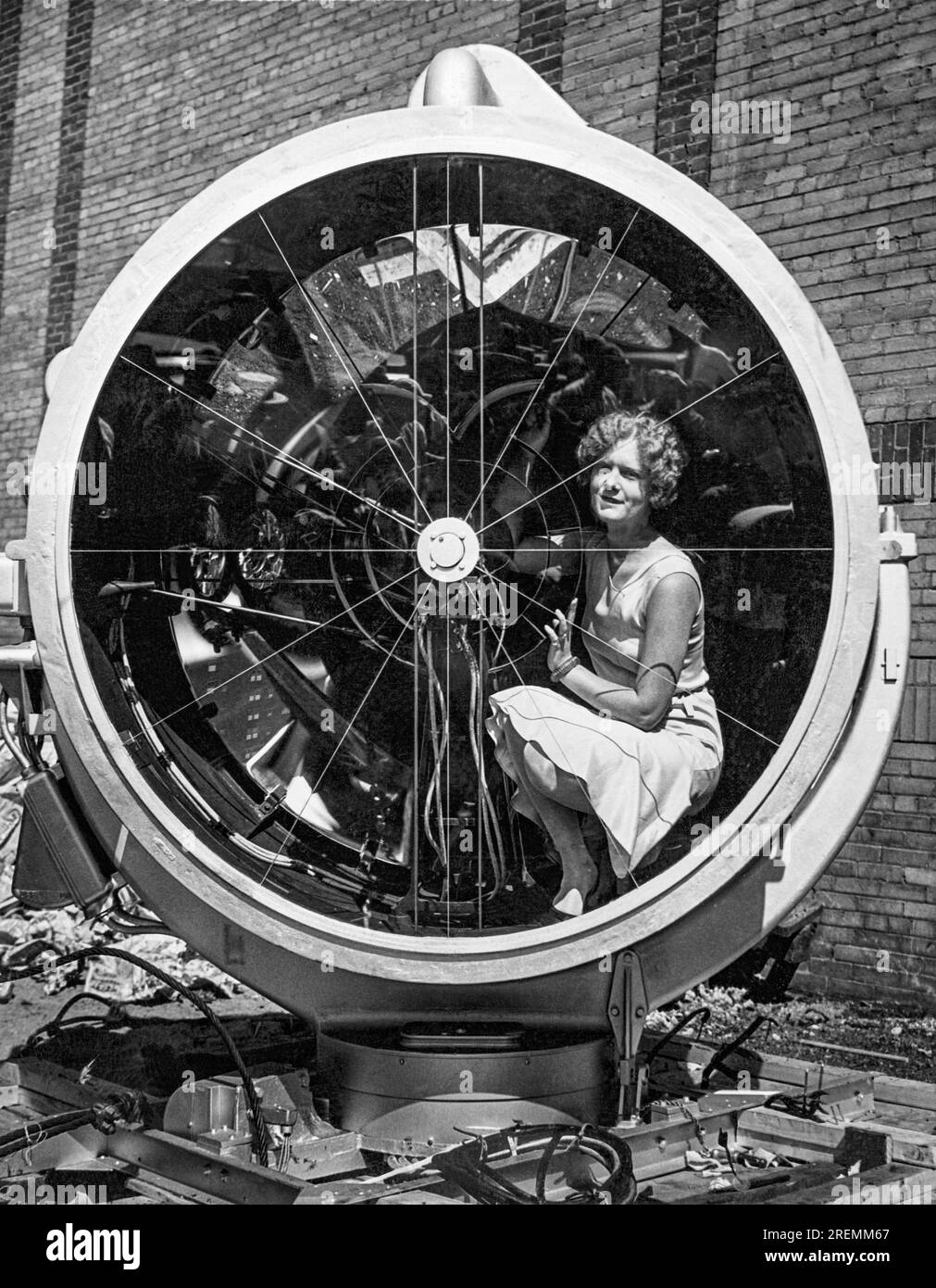 Chicago, Illinois August 12, 1930 A young woman sitting inside the