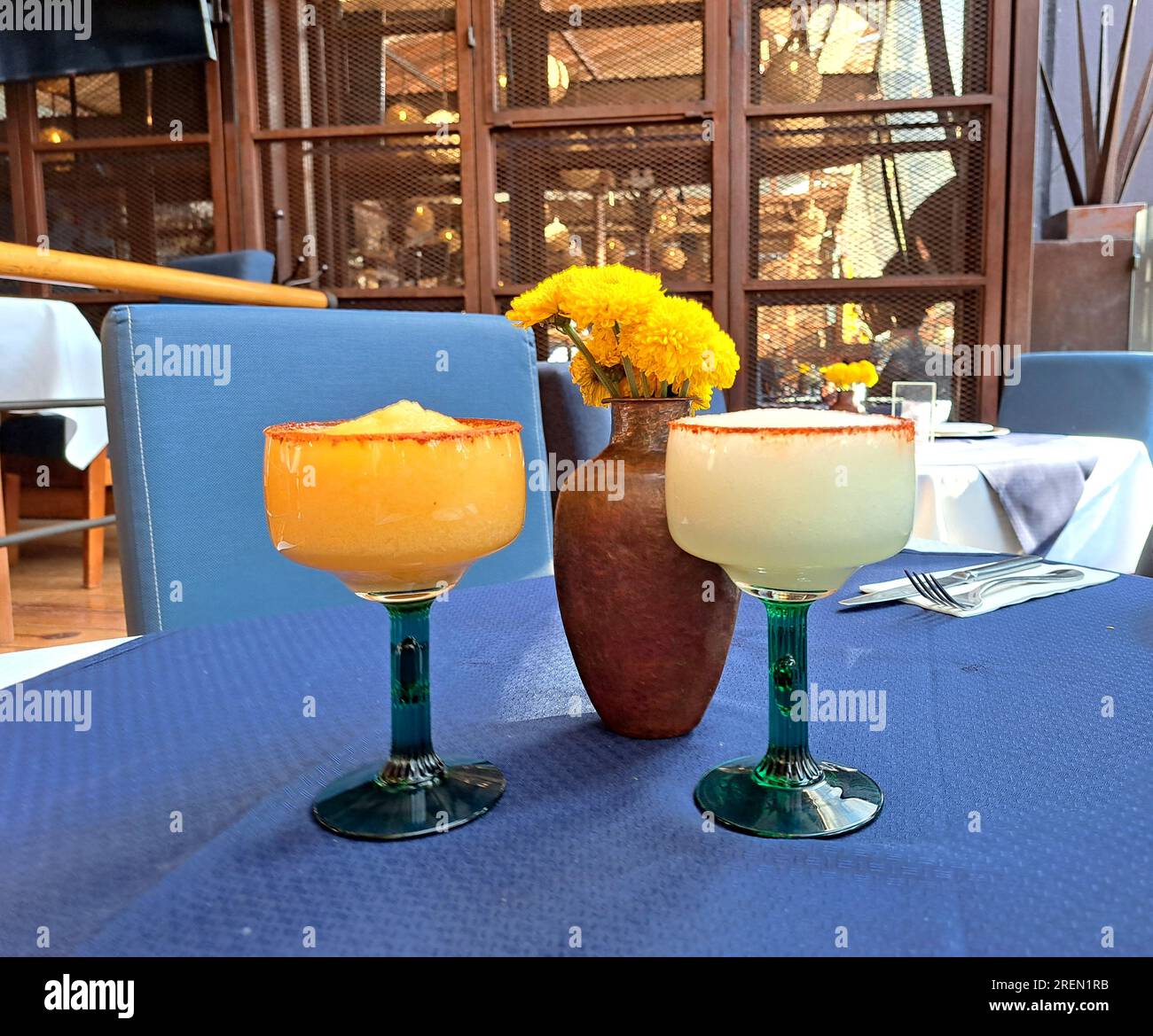 Cups in the shape of a cactus frosted with mango and lemon flavored chili  Margarita cocktail drinks with tequila typical of Mexico Stock Photo - Alamy