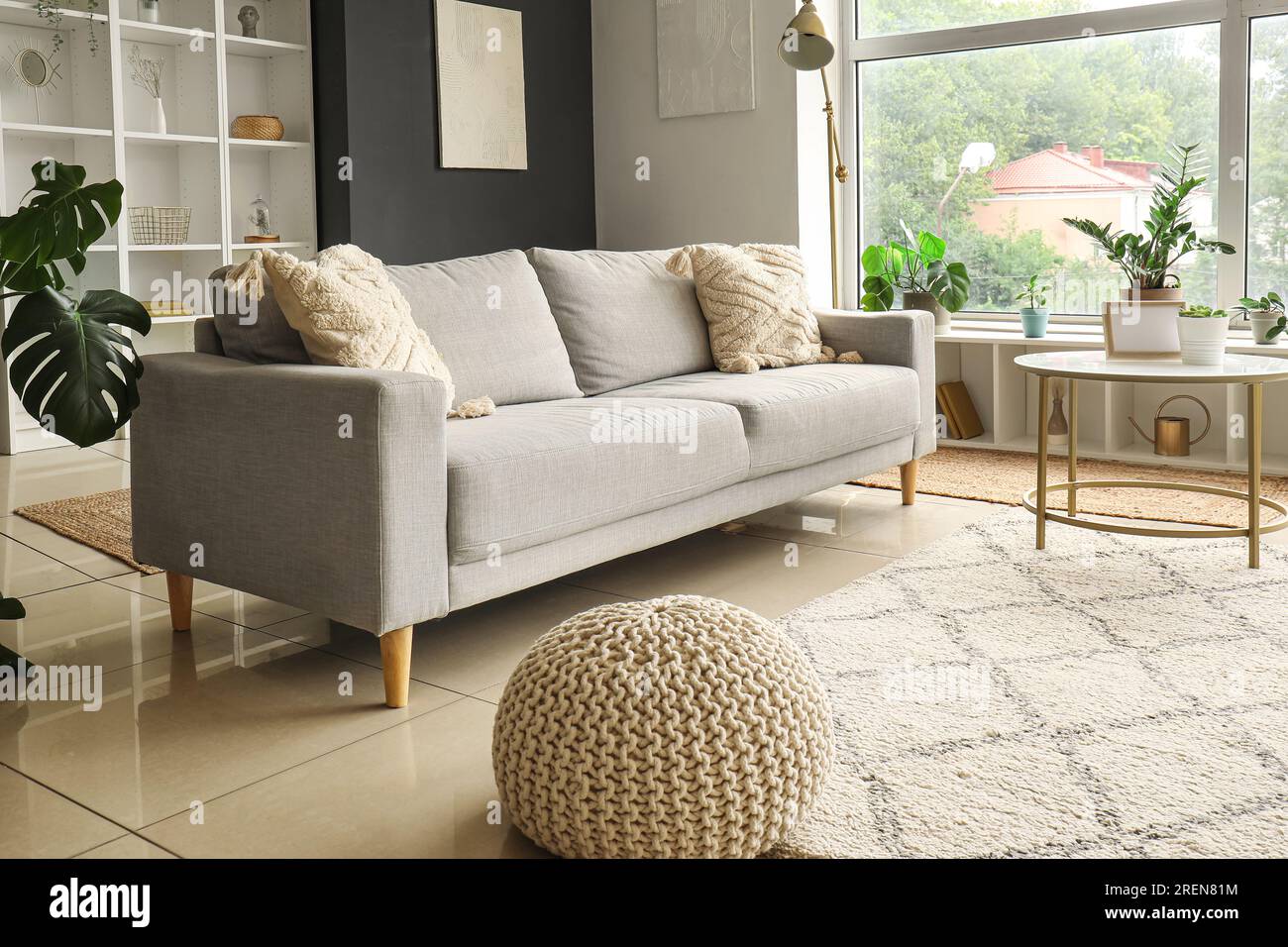 Interior of modern living room with grey sofa and coffee table Stock