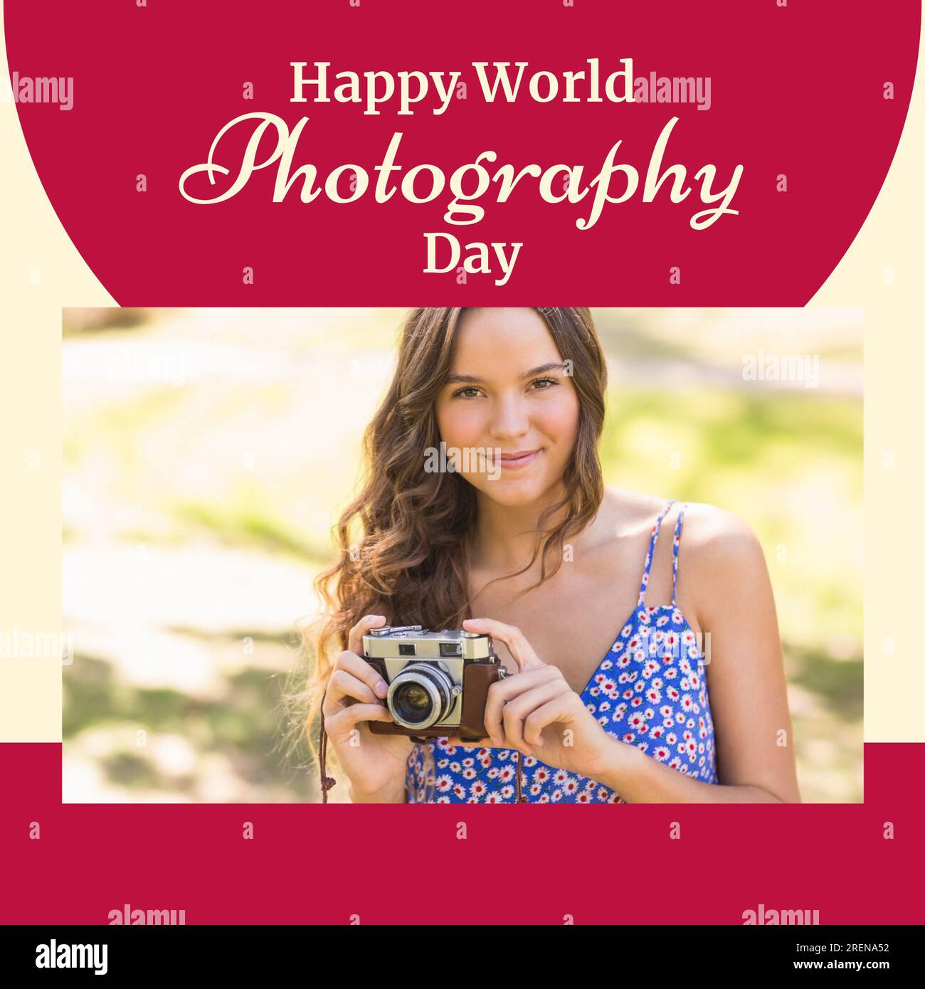 Happy world photography day text on red with happy caucasian woman holding camera in sun Stock Photo