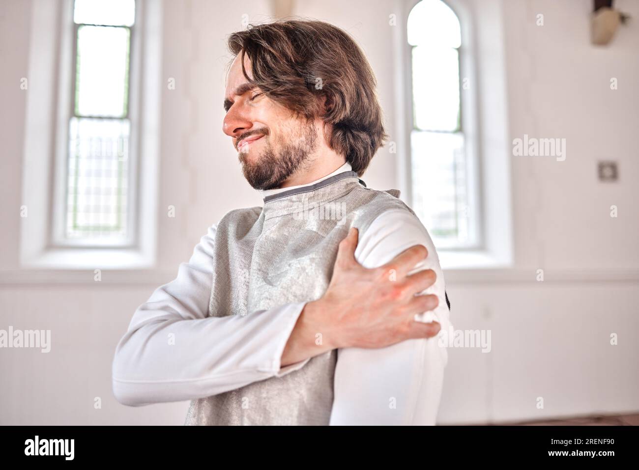Man, fencing and injury, shoulder pain or accident after training, exercise and workout in club