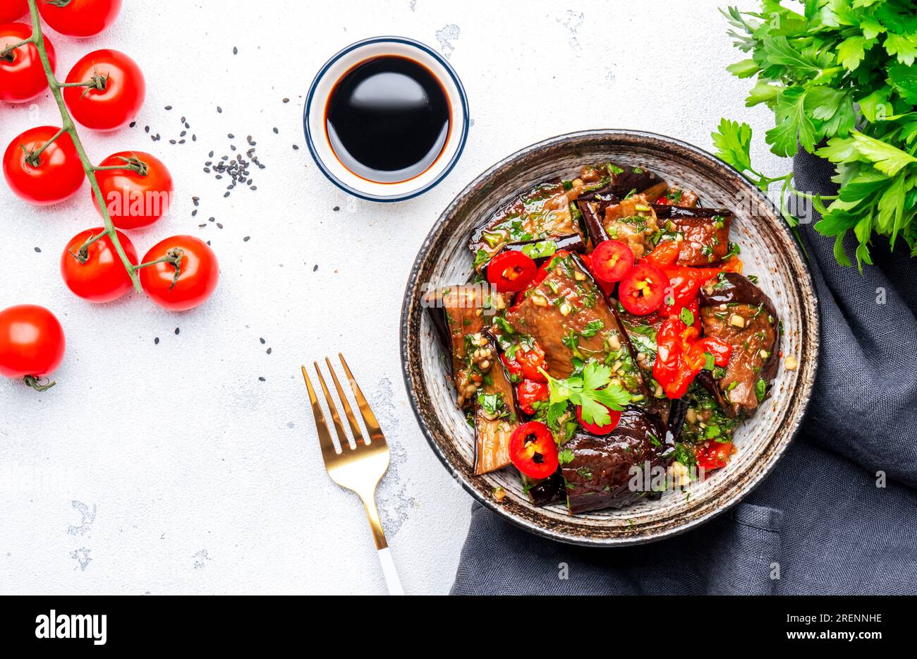 Marinated grilled eggplant with red chili peppers, parsley, sesame seed, soy sauce and garlic
