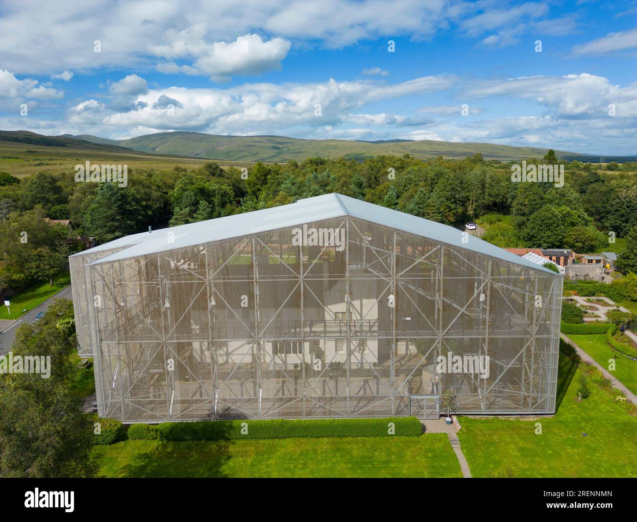 Aerial view from drone of Hill House covered by steel structure box to ...