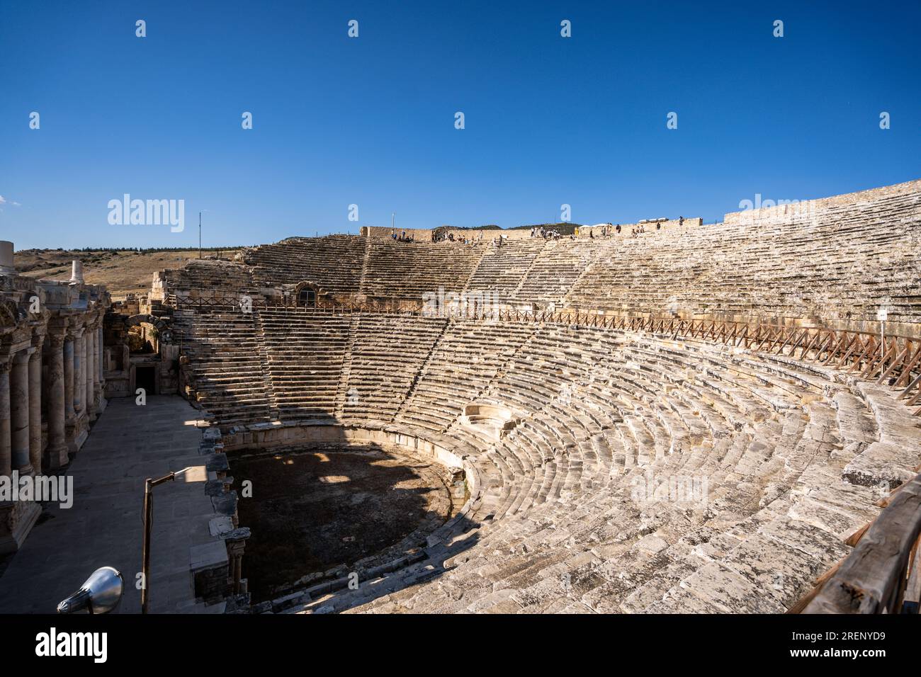 Pamukkale, Hierapolis Pamukkale Archeological Site (UNESCO Site), Natural Travertine Thermal Pools. Ruins of ancient city of old amphitheater. Stock Photo