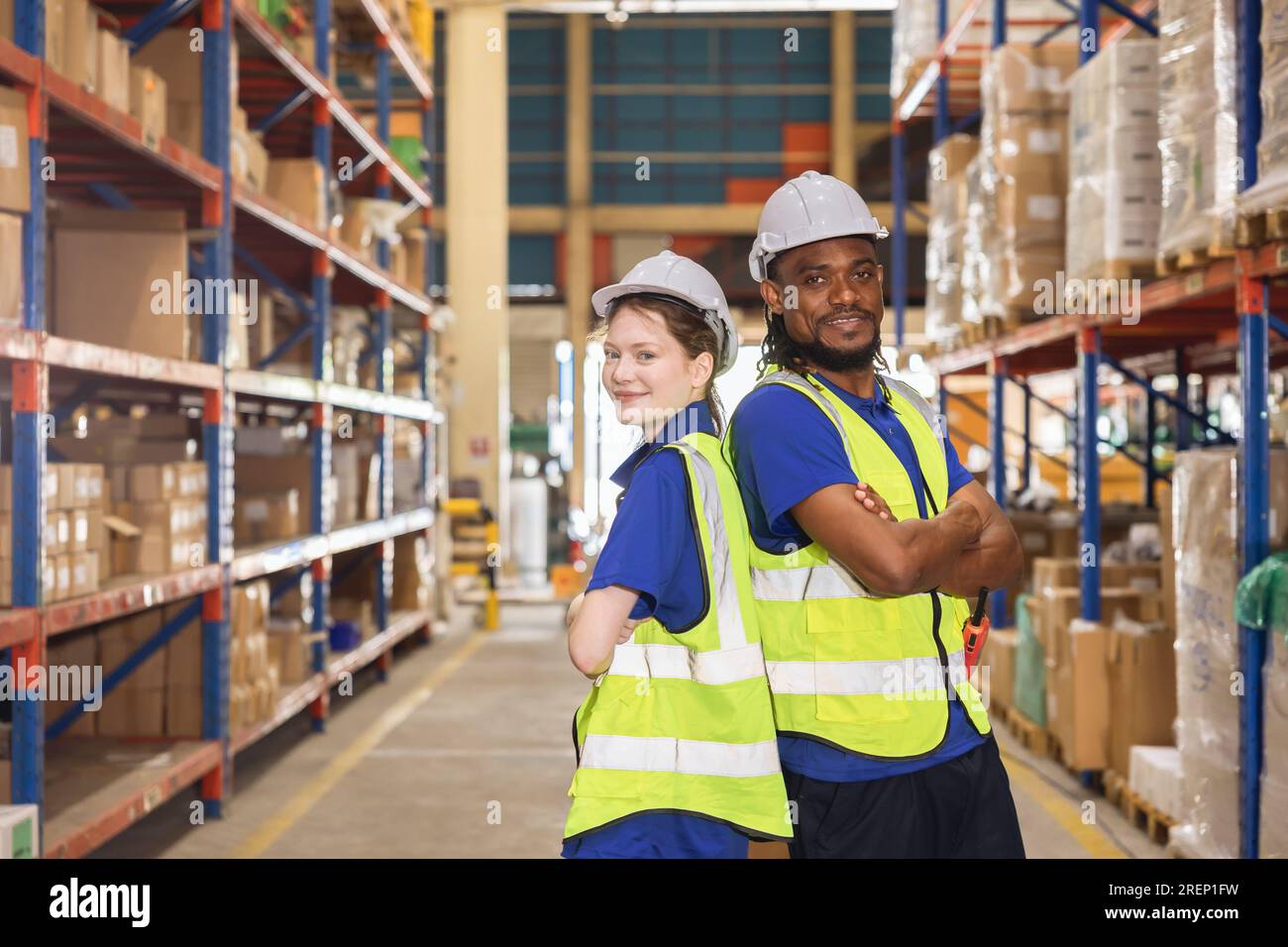 warehouse worker team portrait multiracial standing together happy smiling for industry labor enjoy working teamwork Stock Photo