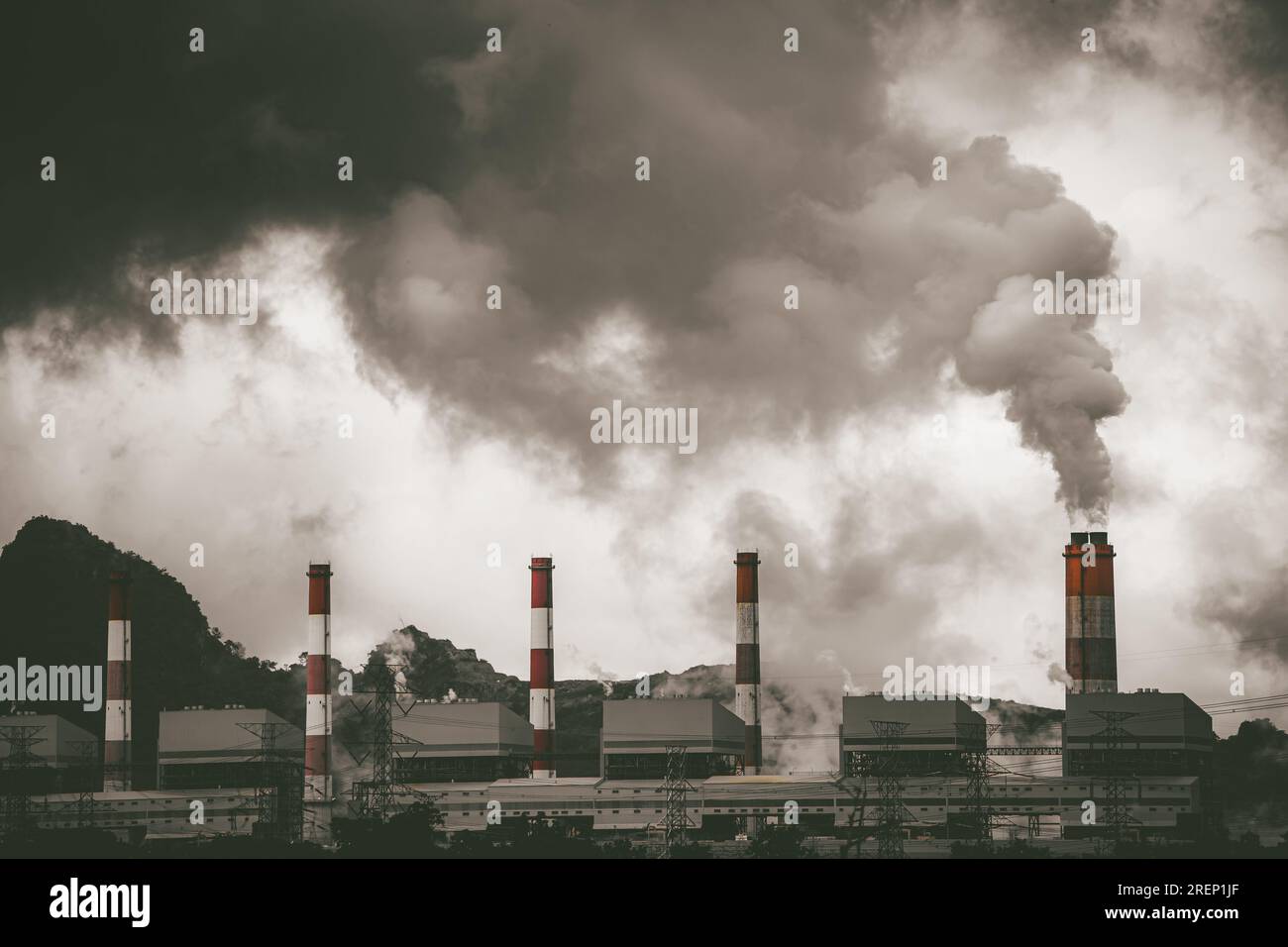 Cole power plant industry chimney release dirty carbon monoxide smoke air pollution and acid rain Stock Photo