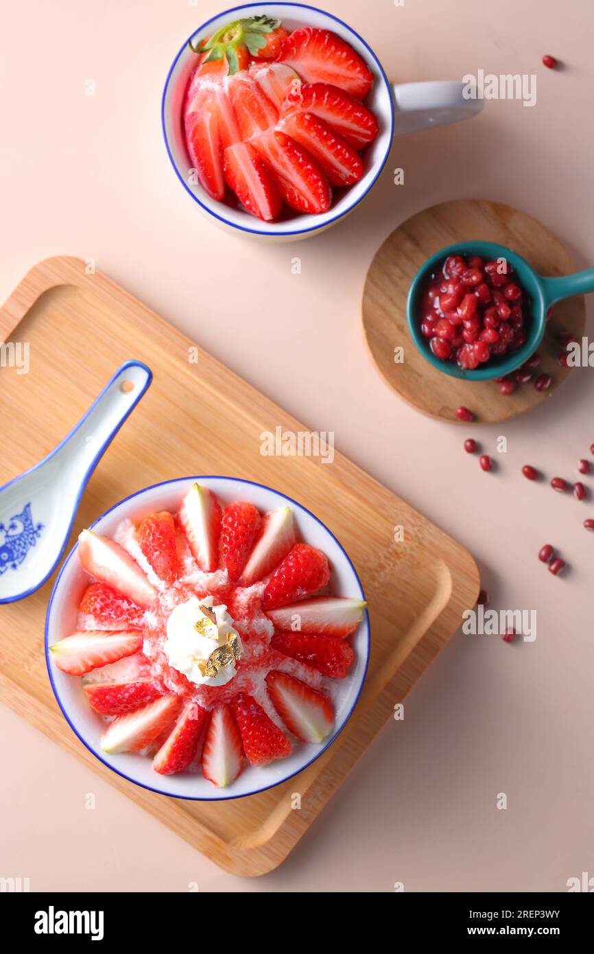 Korean shaved ice dessert with sweet toppings, strawberry Bingsu Stock Photo