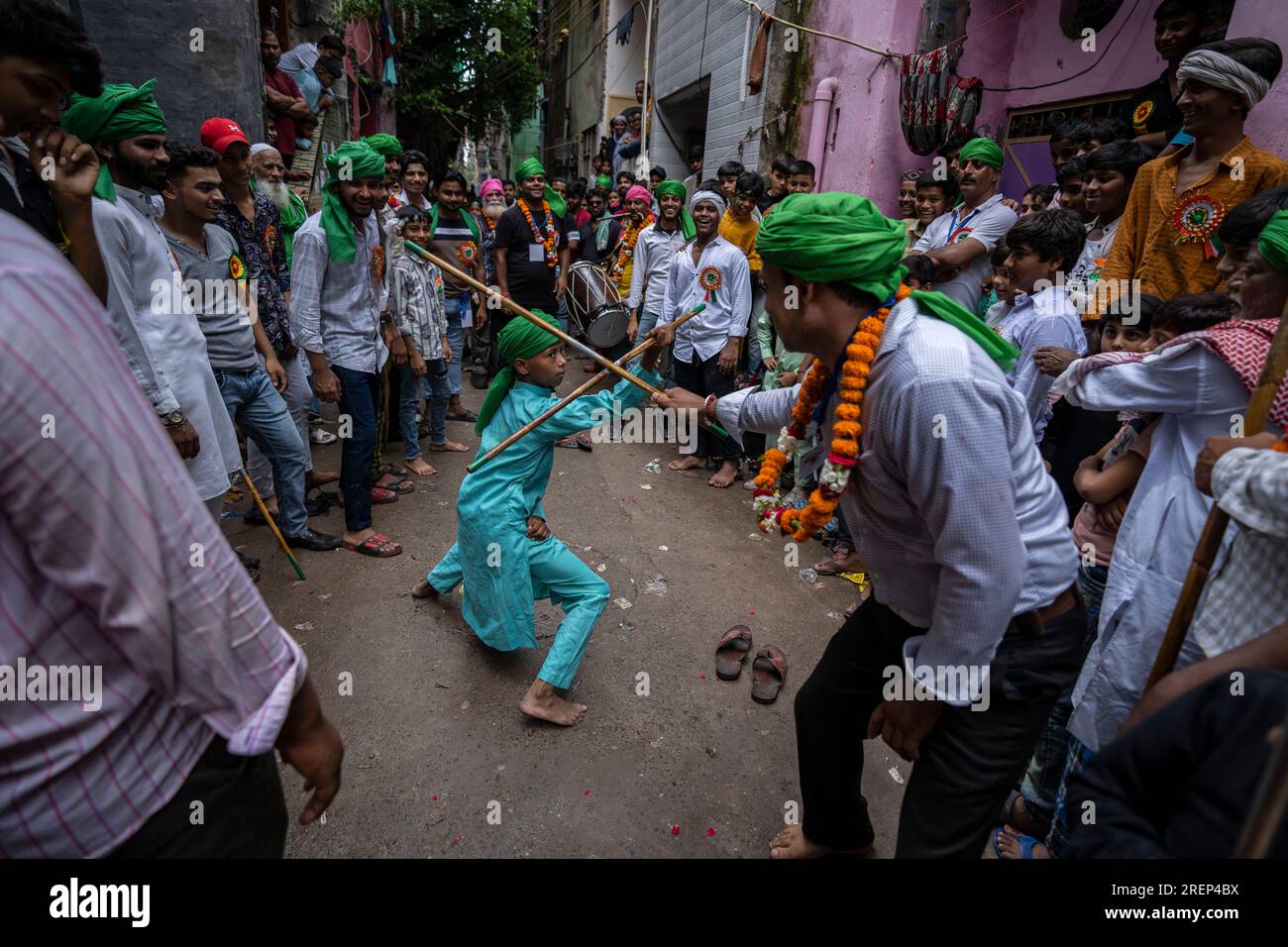 A young Muslim boy displays his stick-fighting skills during a procession  to mark Ashoura in New Delhi, India, Saturday, July, 29, 2023. Ashoura is  the tenth day of Muharram, the first month