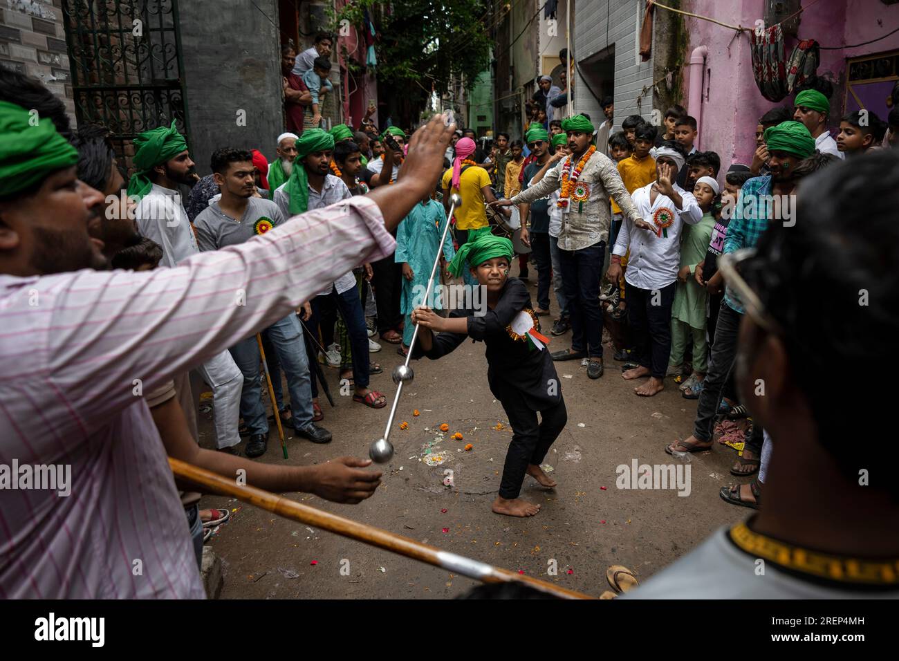 A young Muslim boy displays his stick-fighting skills during a procession  to mark Ashoura in New Delhi, India, Saturday, July, 29, 2023. Ashoura is  the tenth day of Muharram, the first month