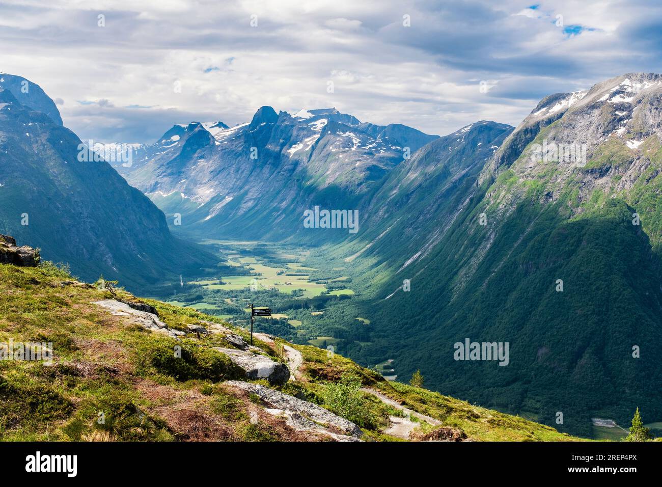 View to Trolltindene or Troll Peaks with Europe's tallest vertical rock face Trollveggen or Troll Wall in Romsdal valley from Nesaksla mountain Norway Stock Photo