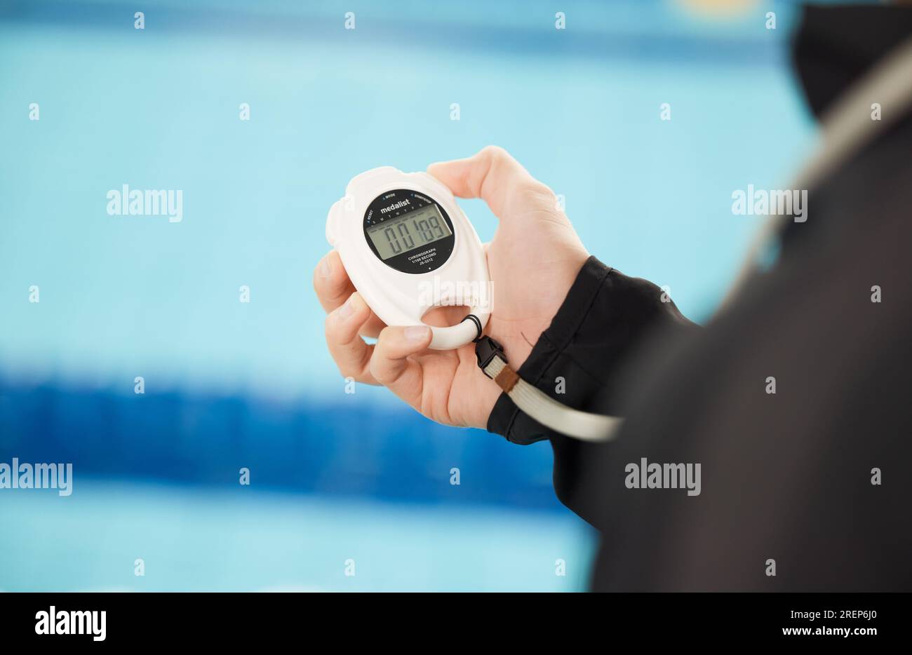 Stopwatch, sports and hands of coach at swimming pool for training ...