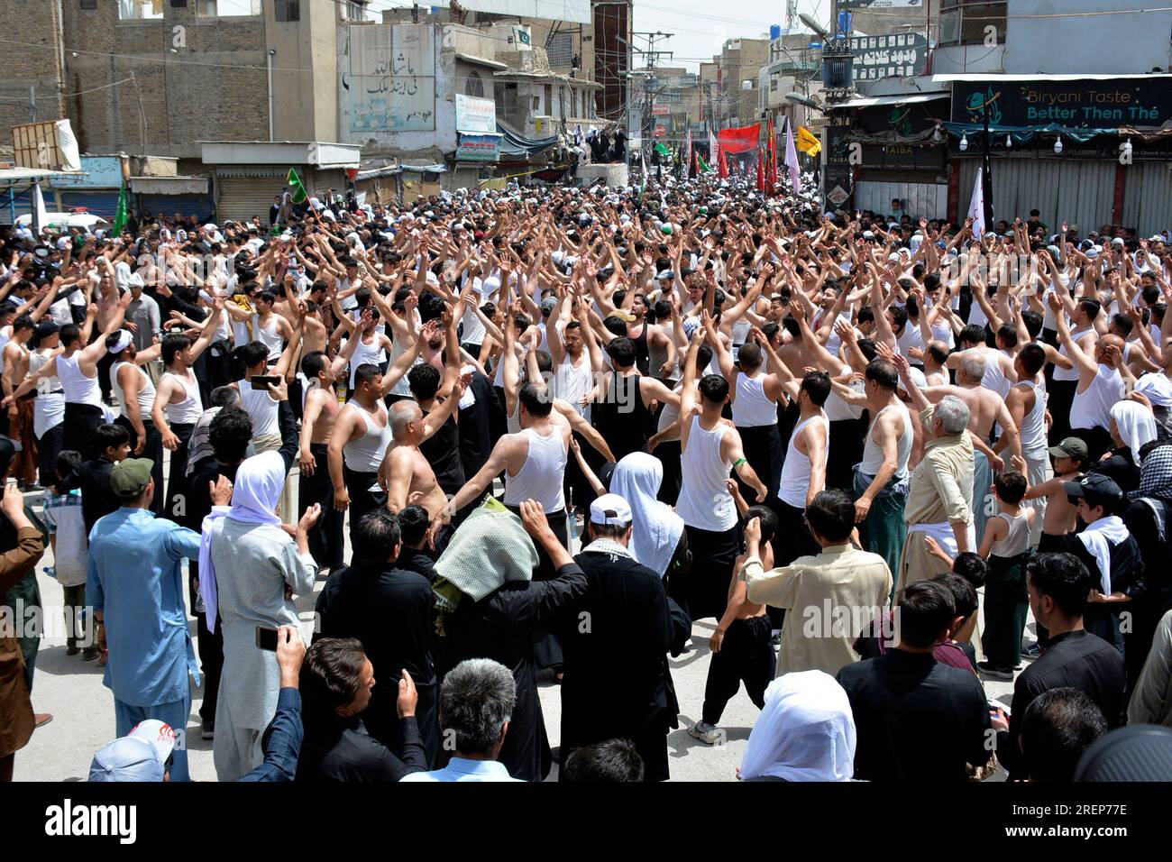 Shiite Muslims gesture during a procession to mark Ashoura, in Quetta ...