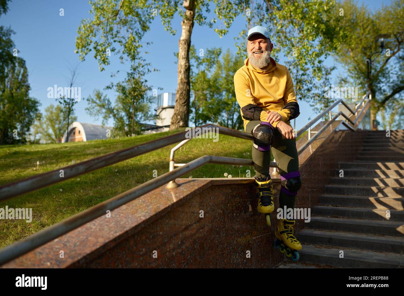 Resting On Railing Senior man wearing roller skates rest sitting on stair railing Stock ...