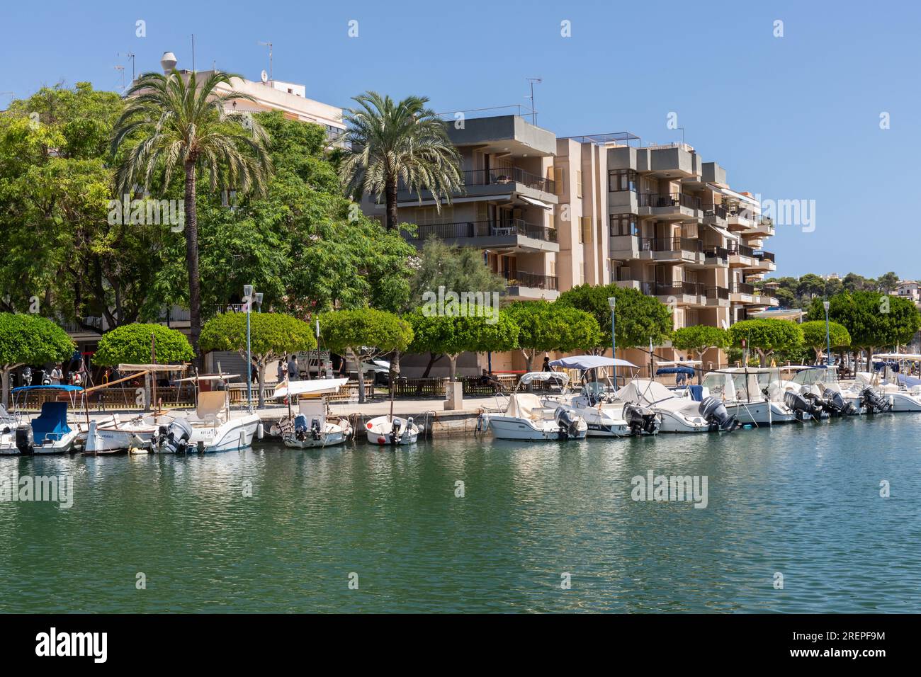 Picturesque Porto Cristo promenade beside the harbour lined with hotels, Porto Cristo Majorca (Mallorca), Balearic Islands, Spain. Stock Photo