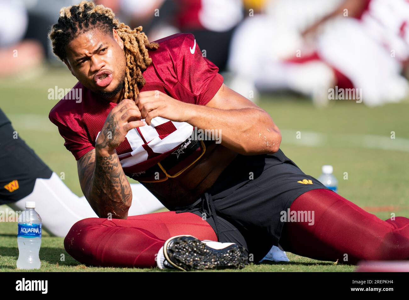 Washington Commanders defensive end Chase Young poses while stretching ...