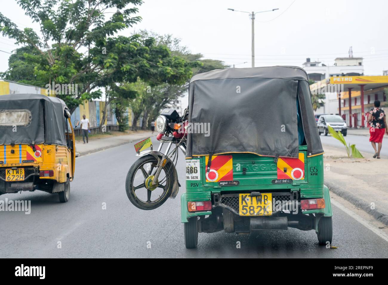 KENYA, Mombasa, traffic, motorcycle transport by auto-rickshaw / KENIA, Mombasa, Straßenverkehr Stock Photo