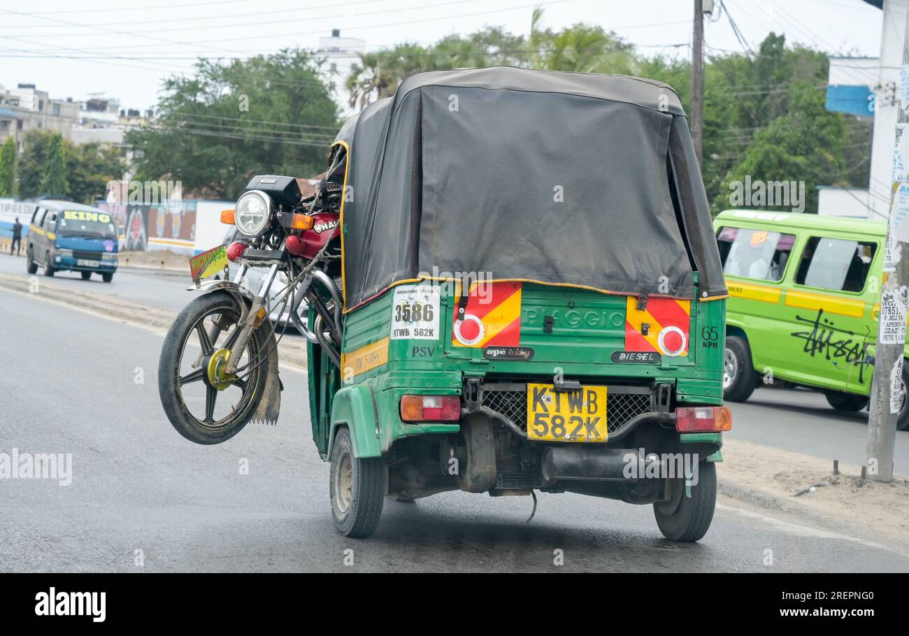 KENYA, Mombasa, traffic, motorcycle transport by auto-rickshaw / KENIA, Mombasa, Straßenverkehr Stock Photo