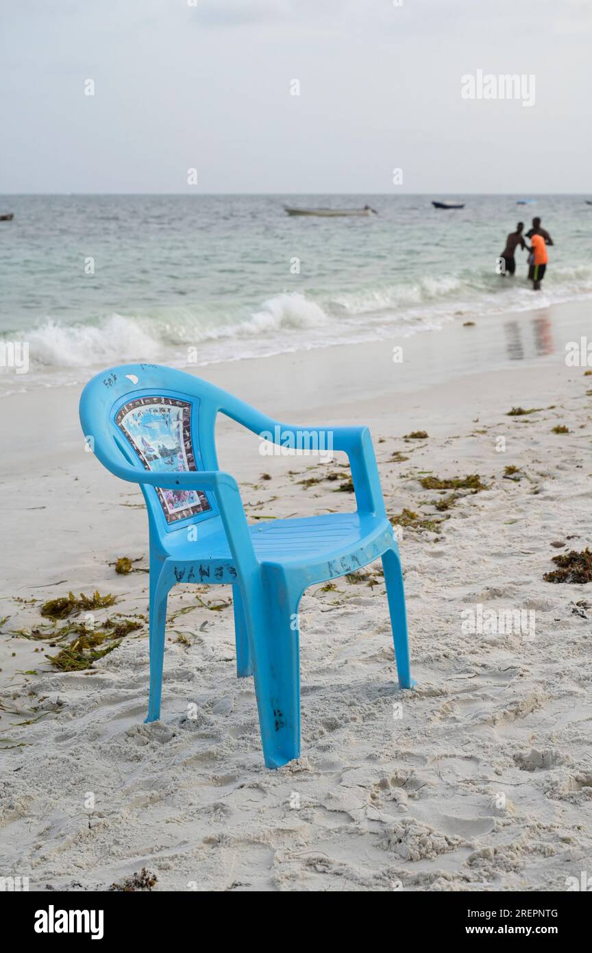 KENYA, Mombasa, tourism, beach indian ocean, plastic chair for tourists for rent / KENIA, Mombasa, Tourismus, Strand am indischen Ozean, Plastikstuhl für Touristen Stock Photo