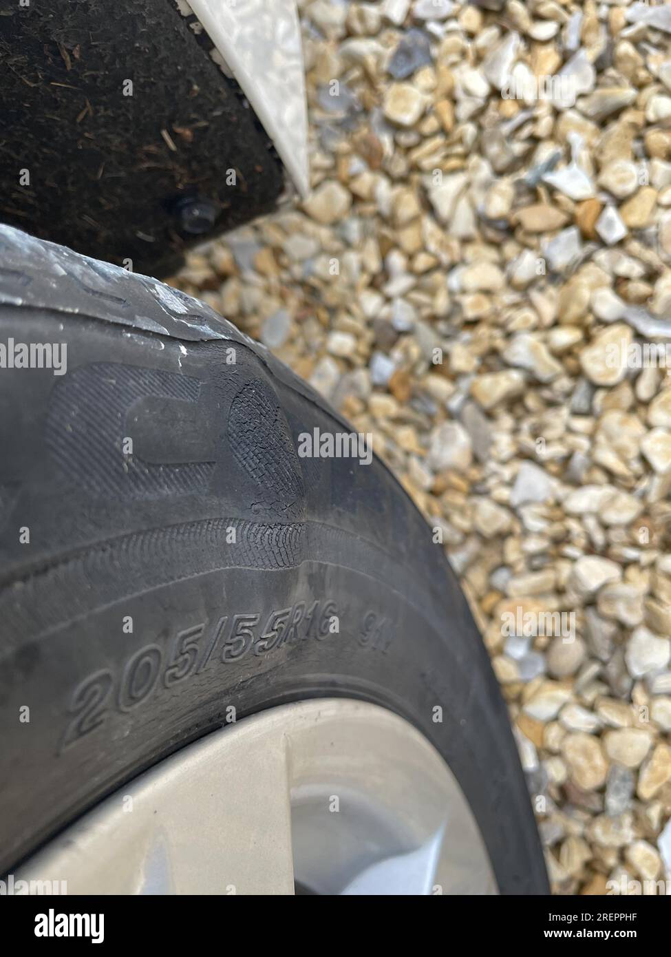 Newcastle UK: 8th July 2023: close-up of a damaged car tyre with a large bulge and persihed rubber Stock Photo